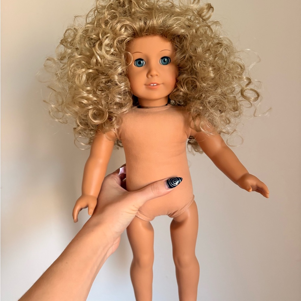 American girl doll- rewigged